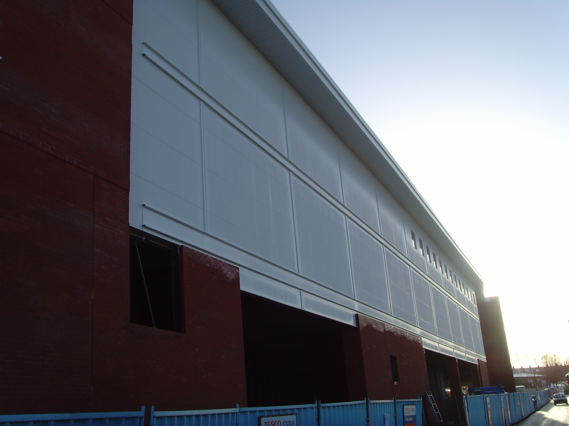 Cladding interface with brick façade on Tesco Oldham exterior